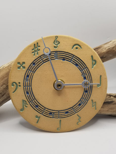 Ceramic clock, music-themed