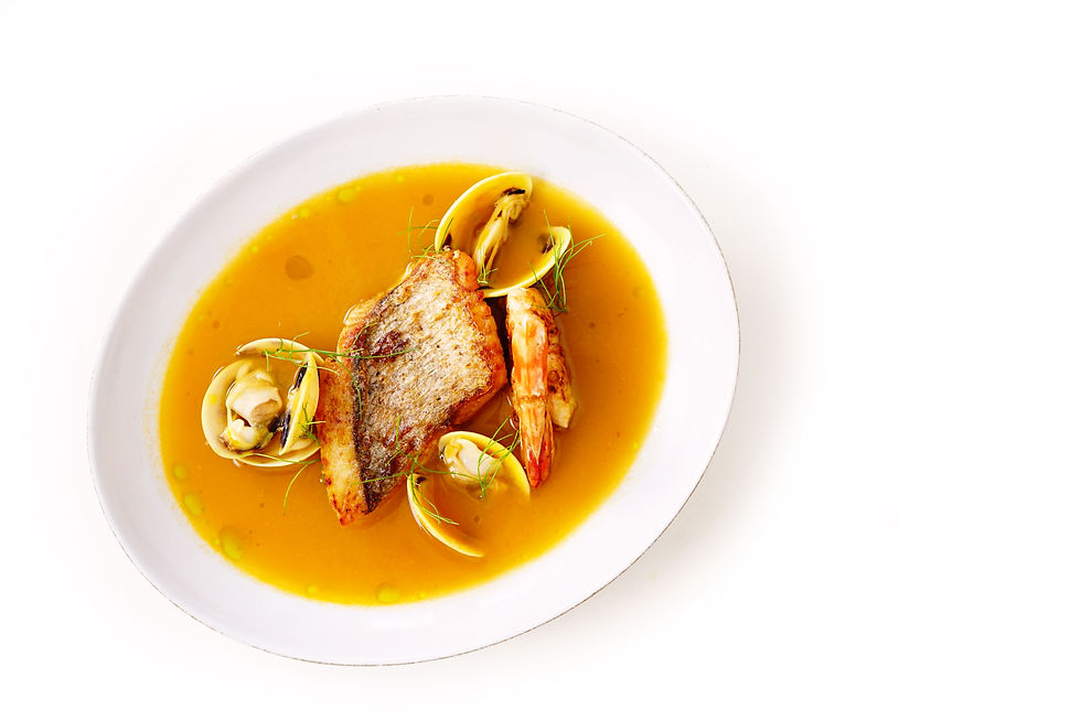 The distinctiveness of Bouillabaisse lies in its rich seafood and aromatic spices.