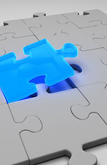 the blue missing puzzle piece fitting into the gray puzzle making it complete