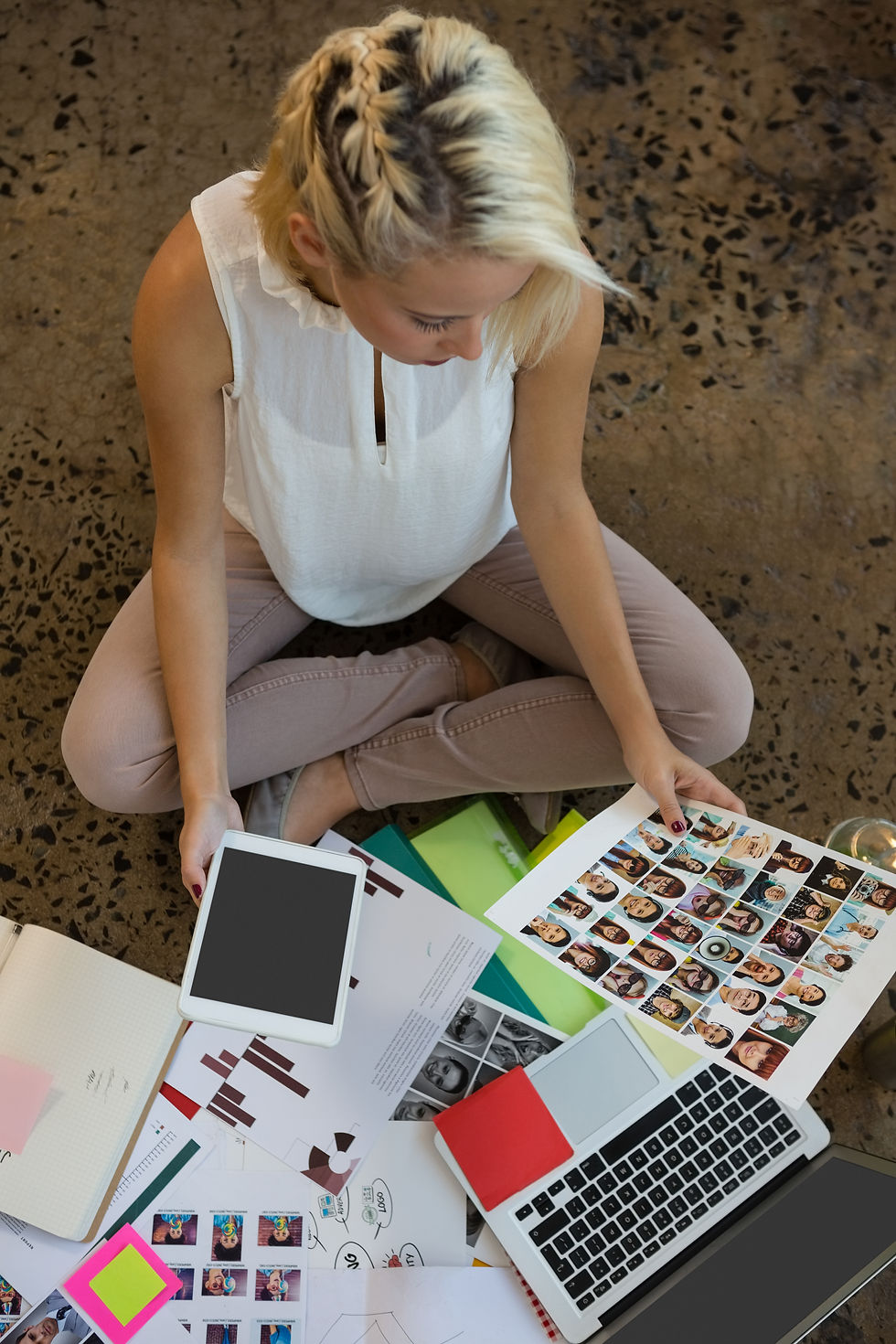 Marketing materials being reviewed. by employee