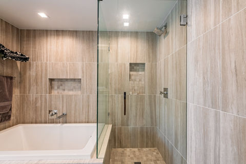 bathroom remodeling los angeles bathtub and walk in shower glass partition wood look tile niche design