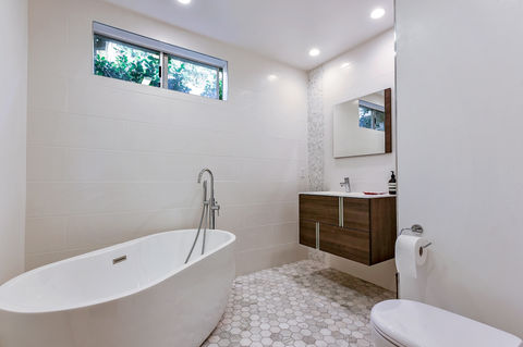 bathroom remodeling los angeles freestanding tub vanity hex tile floor natural light modern bathroom