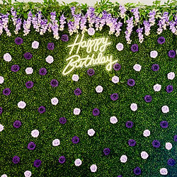 Greenery wall with added florals and led sign