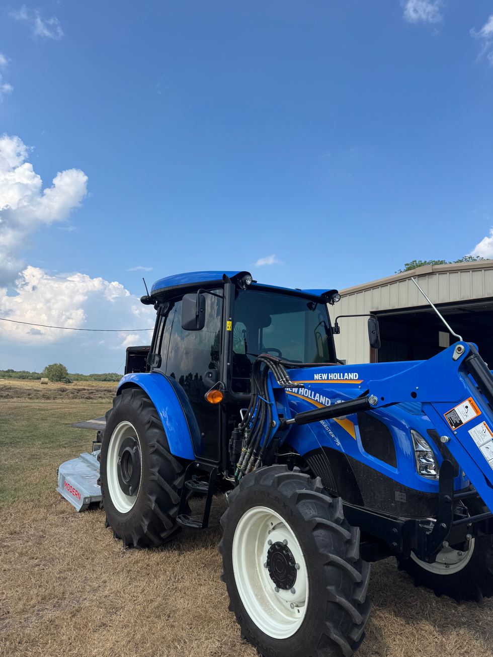 New Holland tractor with tinted windows.