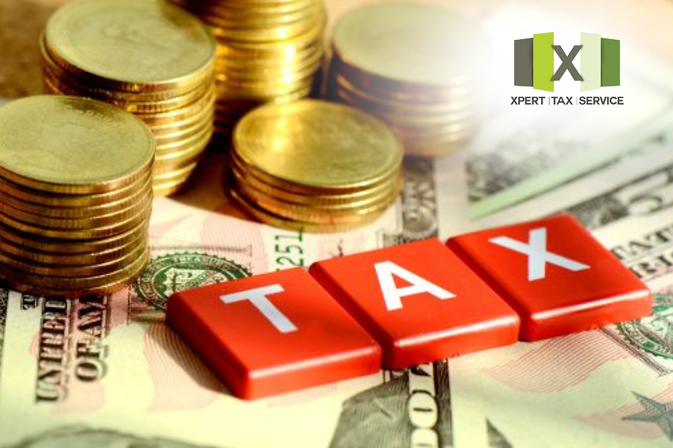 The image shows a pile of U.S. coins stacked alongside U.S. dollar bills, with red letter tiles spelling out "TAX" placed on top of the bills. The image highlights the theme of taxes and money.