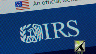 Close-up of the IRS logo on an official U.S. government website screen, representing Internal Revenue Service guidance, tax regulations, and federal compliance, with Xpert Business & Tax Solutions branding visible.