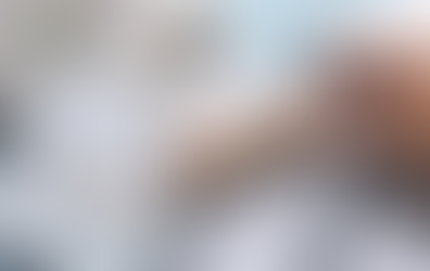 Wooden blocks spelling “TAX 2026” on top of tax forms with calculator, coins, and Xpert Business & Tax Solutions logo.