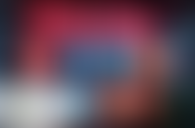 Wall display featuring neon text 'Social media' above eight circular icons representing popular social media platforms, including Instagram, Facebook, LinkedIn, Twitter, and a play button, arranged in two rows against a red brick background. A green plant is partially visible in the lower right corner, and a small logo for 'Xpert Business & Tax Solutions' is in the lower left corner.