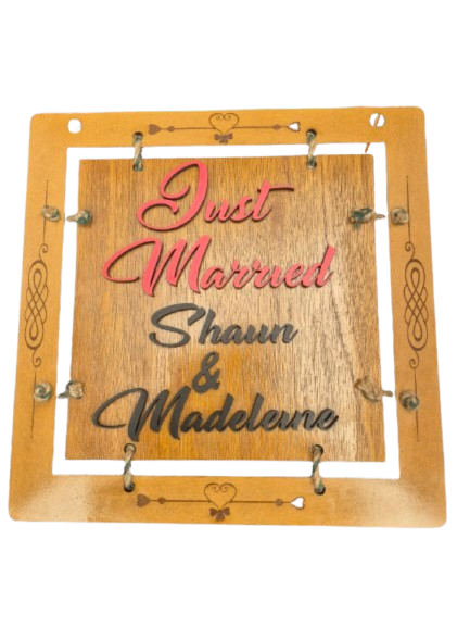 Thumbnail: Handmade double-sided wedding plaque with raised Just Married letters and couple’s names, rustic oak finish