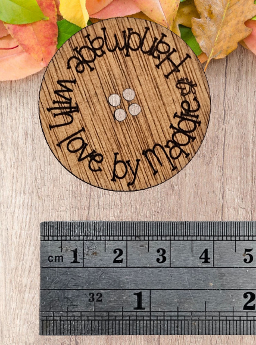 Thumbnail: Personalised wooden sew-on buttons engraved with “Handmade By” design