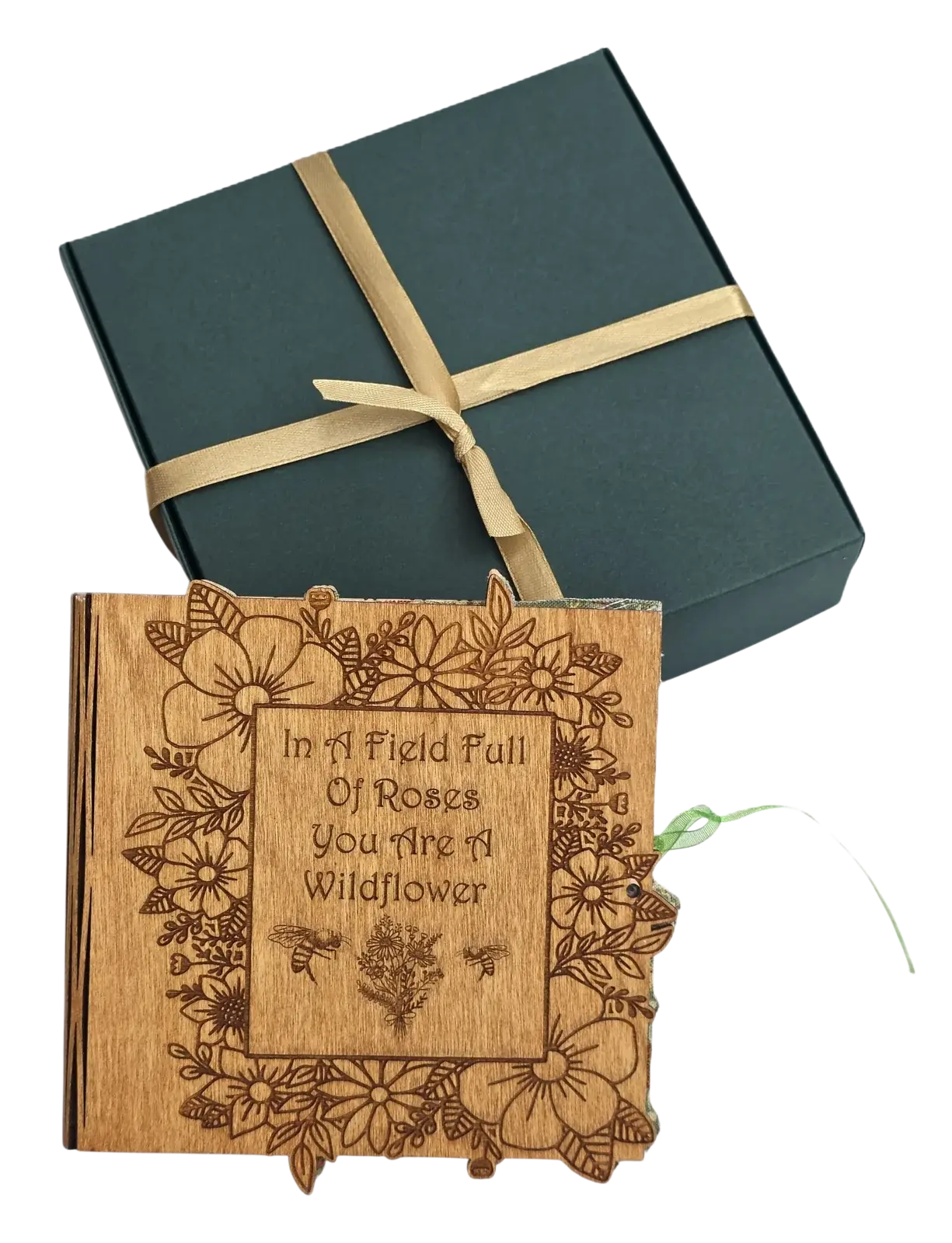 Wooden floral wildflower greetings card beside its green gift box and gold ribbon