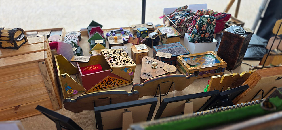 Bee Kind Reimagined market stall displaying handmade wooden boxes, fabric bags and decorative gifts