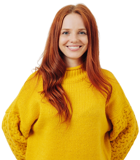 woman with red hair in yellow sweater smiling