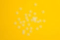 abortion pills on yellow background