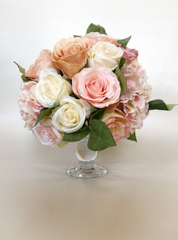 short glass candlestick flower table arrangement