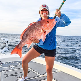 girl holding snapper