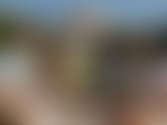 A group of friends having a picnic with boba tea on the MIT campus, in front of the Great Dome in Boston.