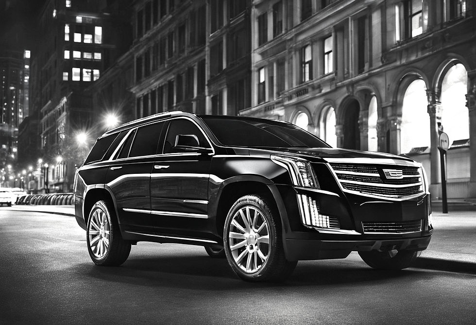 black Cadillac Escalade luxury SUV for luxury concierge servicing clients driving in bu