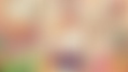 a slim woman sitting in front of a table with healthy food contemplating orthorexia support at the eating disorders clinic