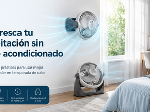Habitación fresca con ventilador MAN cerca de una ventana, cortinas claras, cama o escritorio, sensación de aire circulando.
