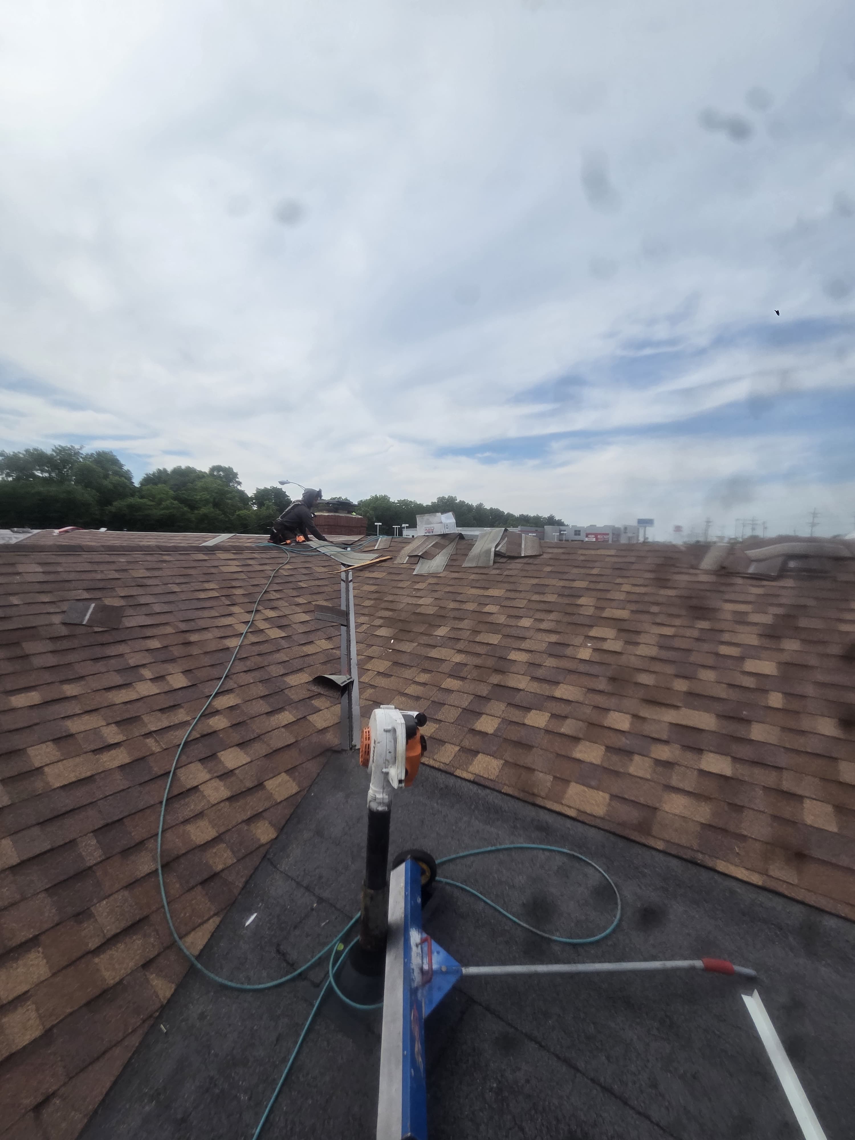 Shingle installation across the roof slopes — Maverick Exteriors