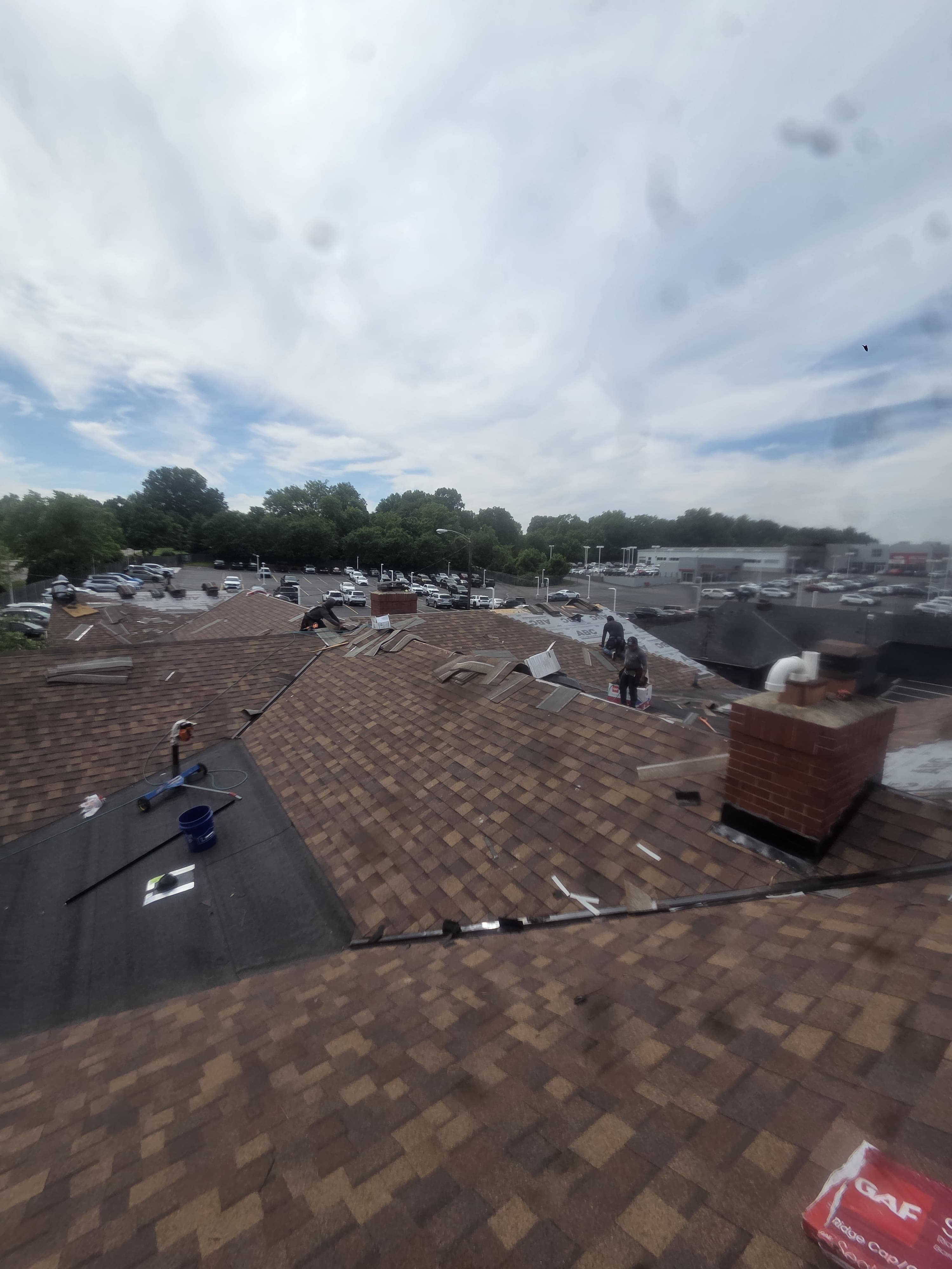 Roof replacement progress across multiple slopes — Maverick Exteriors