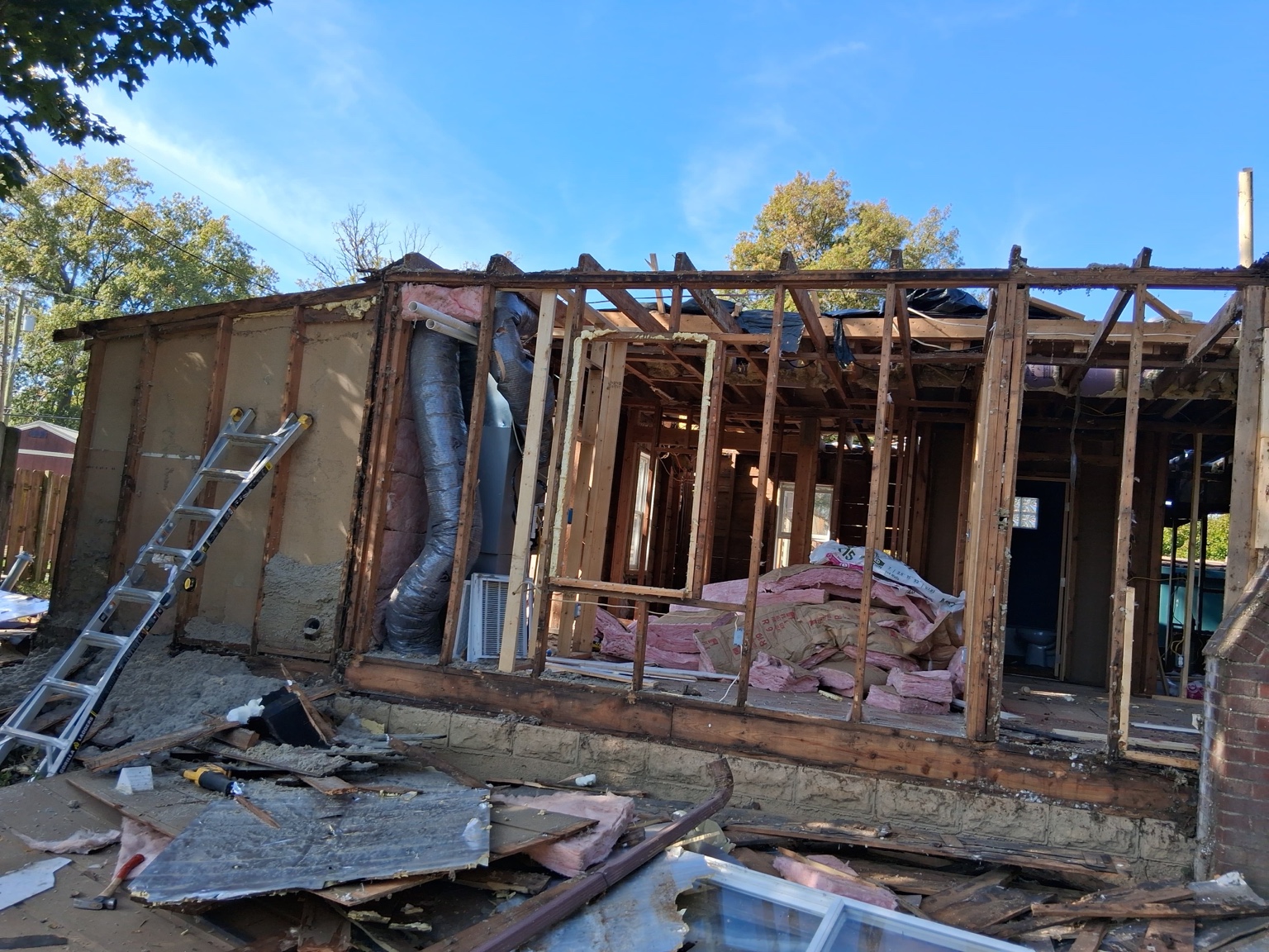 Wide view of the property during demolition — Maverick Exteriors project
