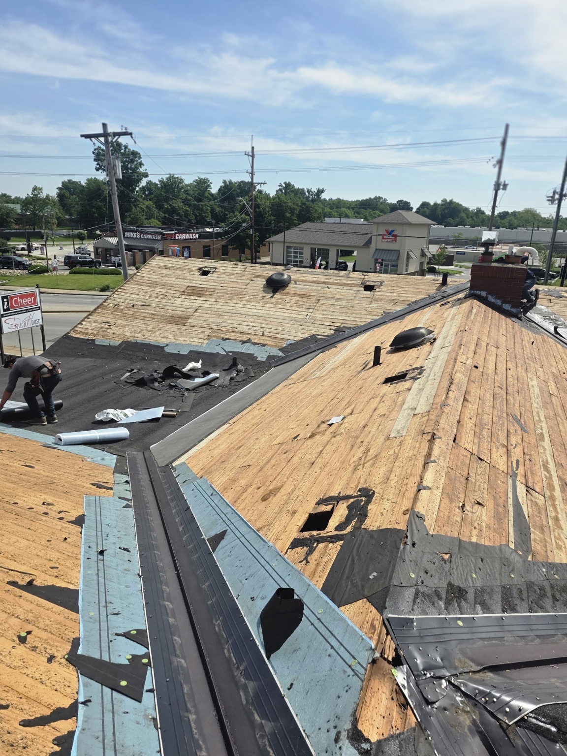 Roof decking exposed during removal of old roofing — Maverick Exteriors