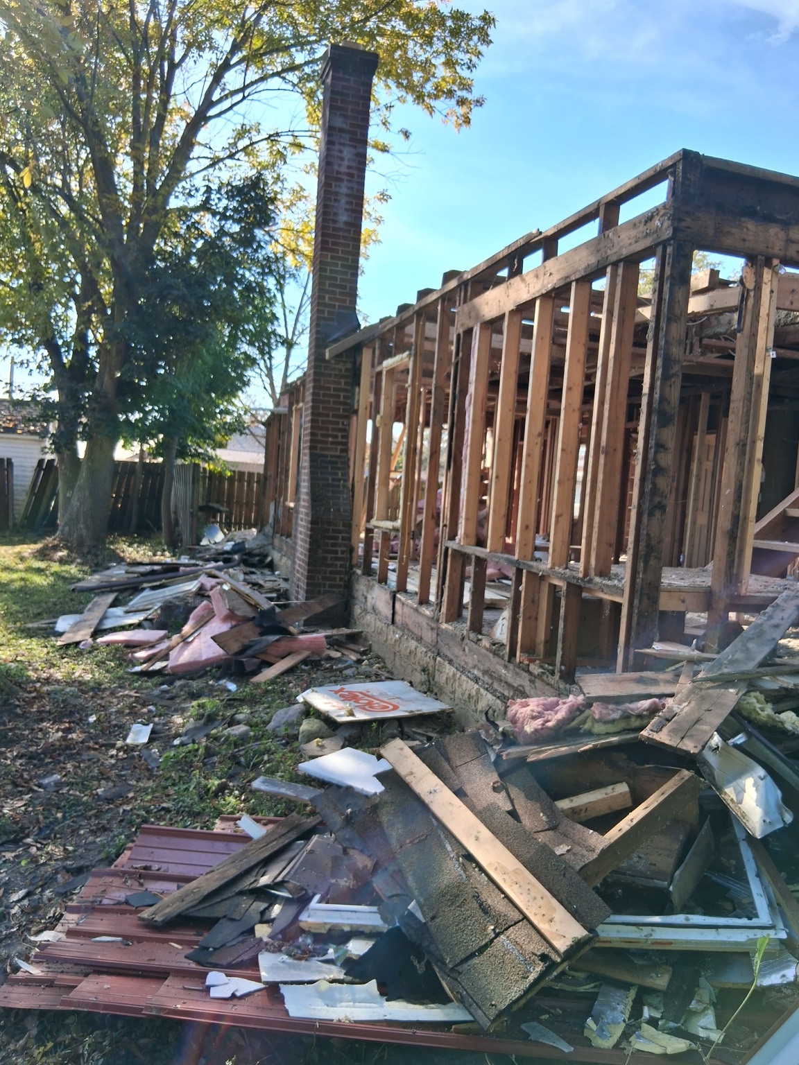 Side view of exposed framing during renovation — Maverick Exteriors project
