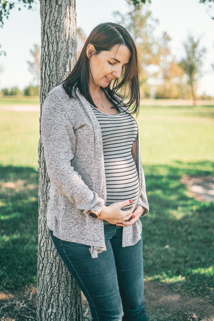 Gestational Carrier, Ivana, embracing her surrogacy pregnancy.