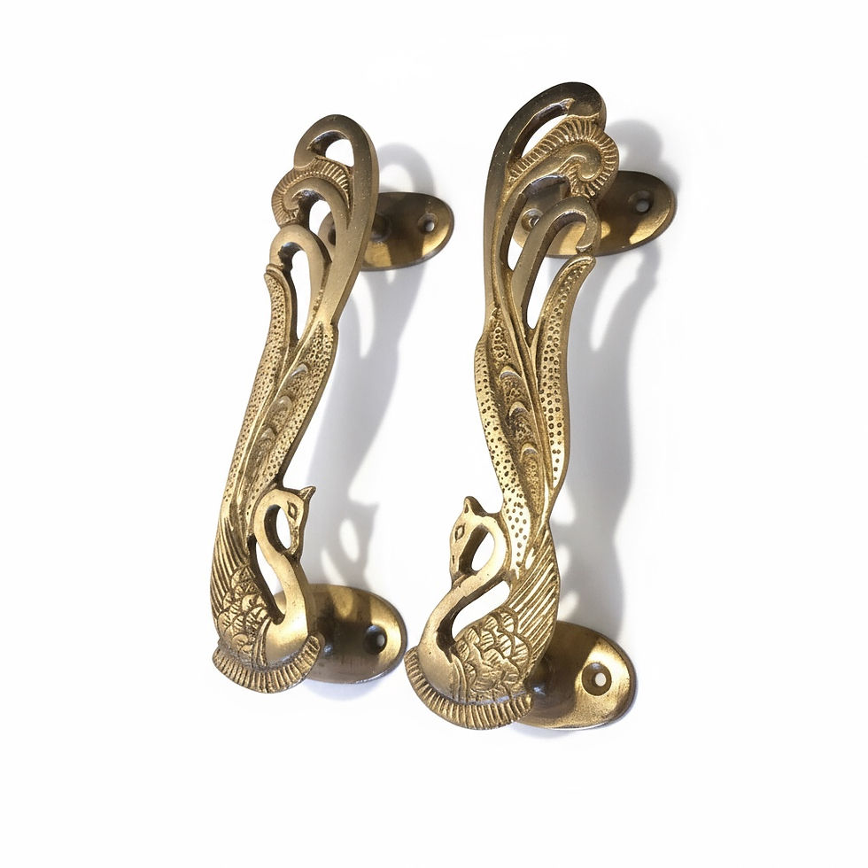 Thumbnail: Decorative brass cabinet handles featuring stylised peacock design