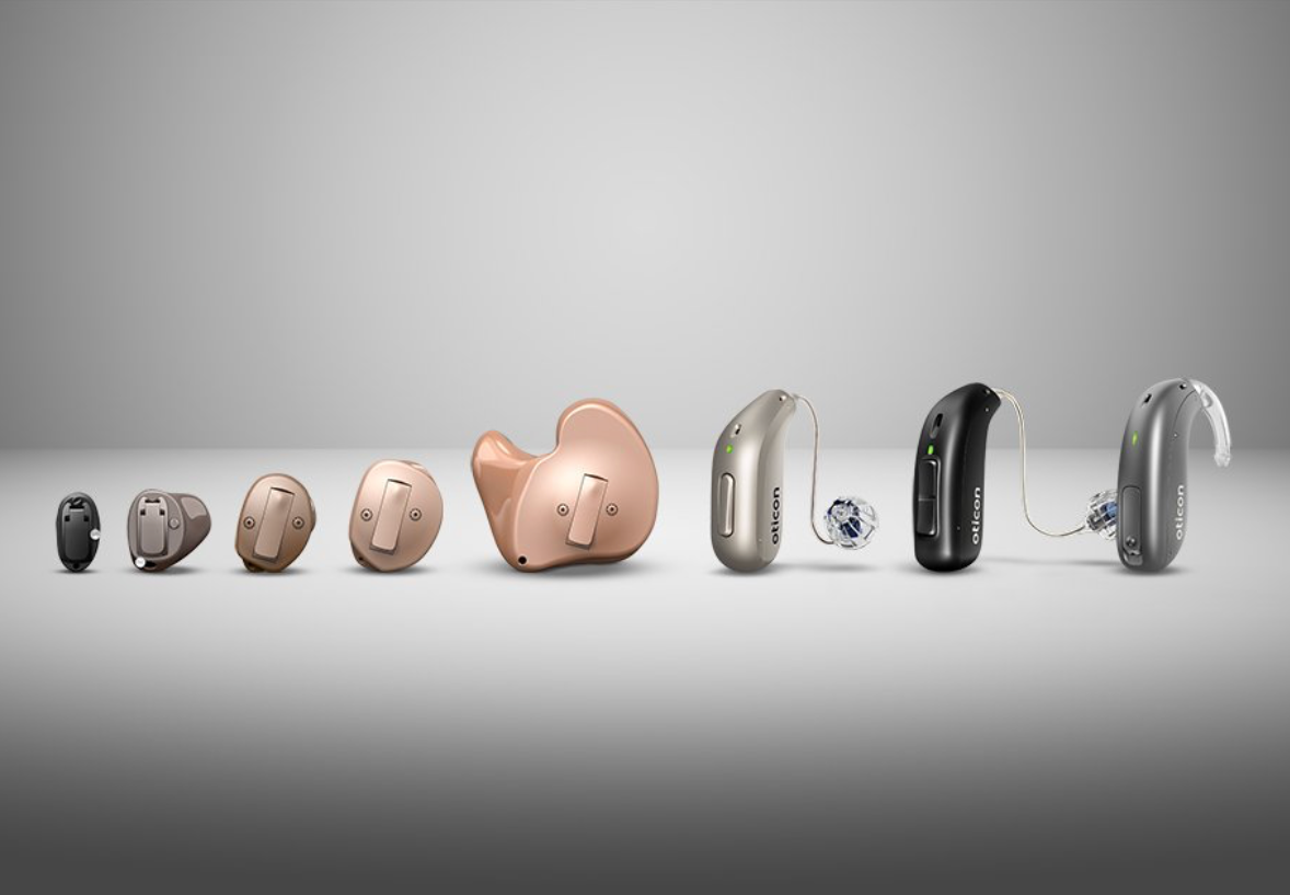 A variety of hearing aids in different sizes and styles, illustrating options available for various hearing needs and preferences