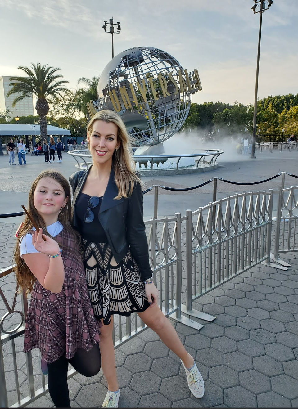 Girl and woman in front of Universal Studios globe