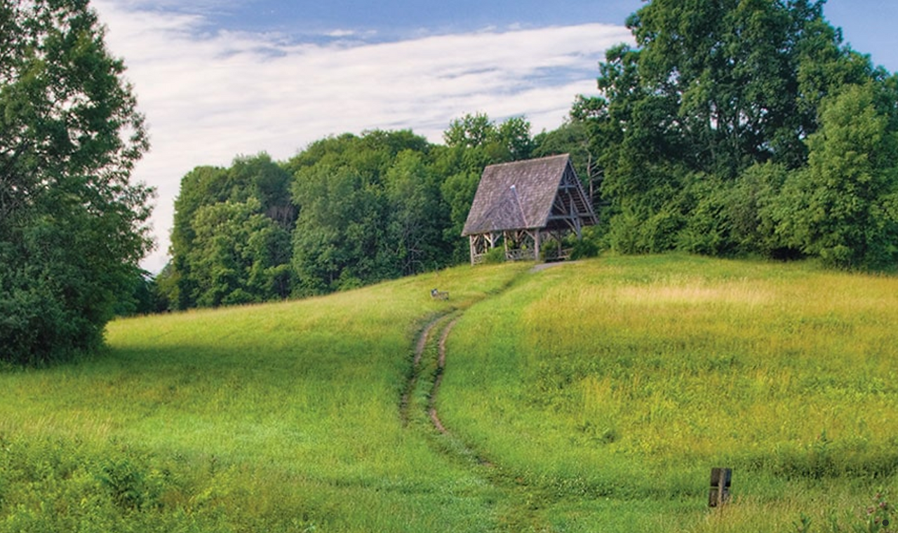 Cabin on a grassy knoll