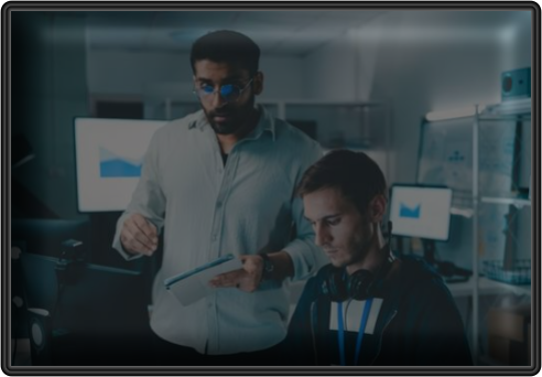 A tech boss instructing one of his employees for a tech business
