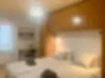 Simple bedroom for construction workers in corporate housing apartment