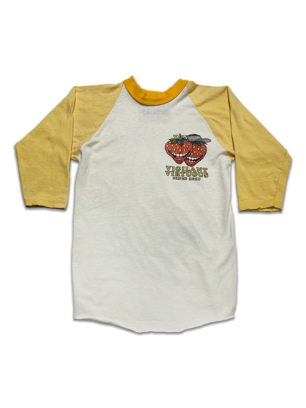 Front of yellow-sleeved raglan tee with two stacked cartoon strawberries, mouths open and smiling, with “Vigilant Virtuous Si