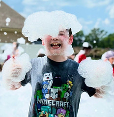 thumbs up in the foam at daycare party