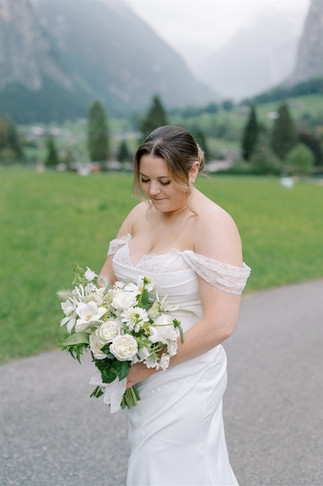 Couple eloping in the rain in Lauterbrunnen, Switzerland
