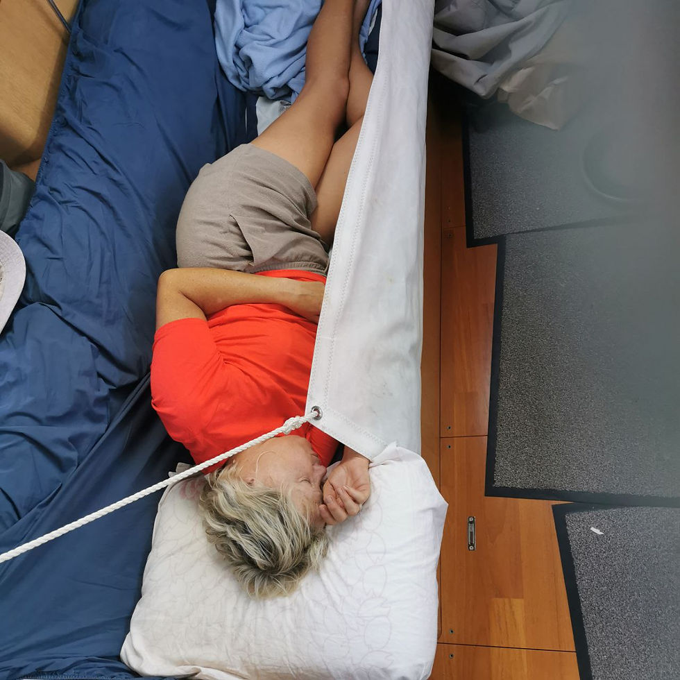 Annick sleeping, held in by the lee cloth