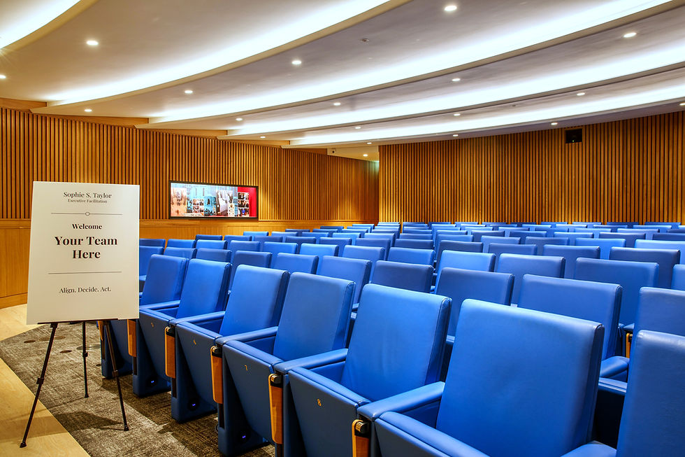 Auditorium with blue seating for leadership retreats.