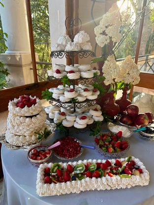 Meringue Nests topped with berries and tropical fruit