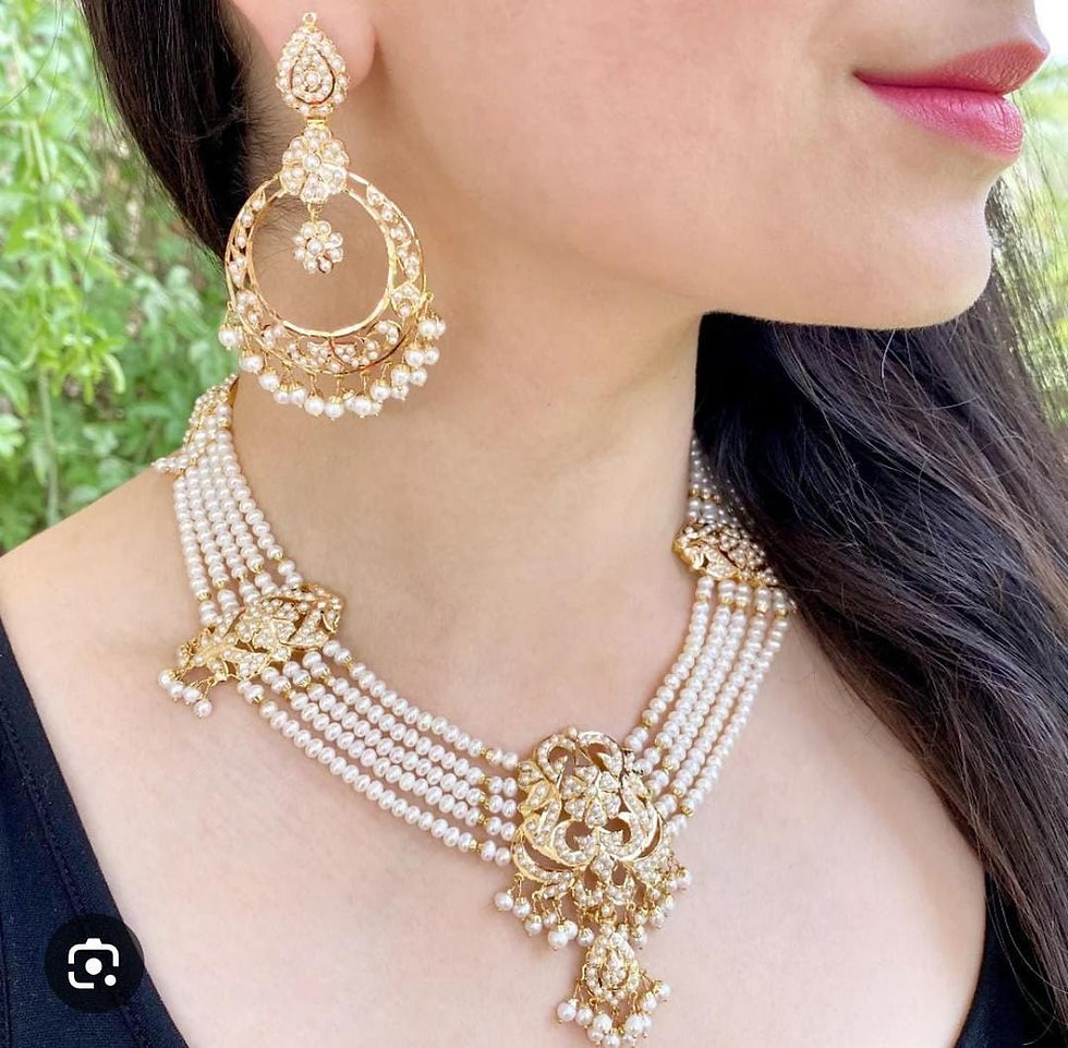 Thumbnail: gold-plated jadau choker necklace set featuring pearls, rubies, and emeralds. 