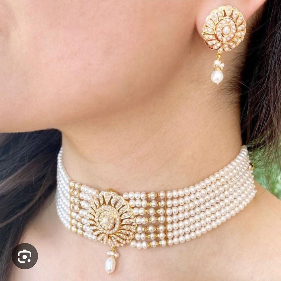 Thumbnail: gold-plated jadau choker necklace set featuring pearls, rubies, and emeralds. 