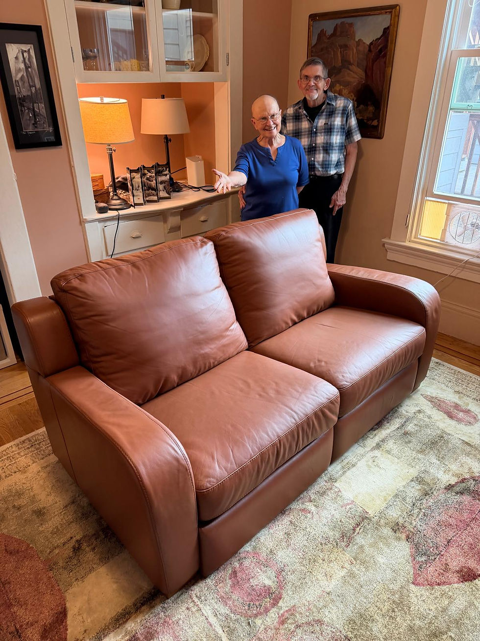 Professionally restored leather recliner with happy homeowners after leather repair, leather restoration, color restoration, leather refinishing, cleaning, conditioning, and cushion restuffing in San Francisco, California.