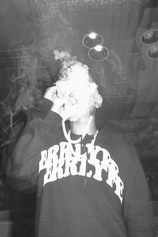 Poppi smoking at Eladio Carreon's studio sesion. Shot on 35mm film in LA, CA. 2022.jpeg