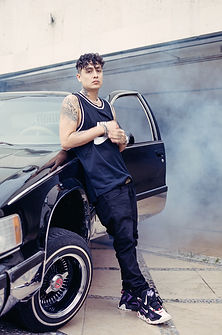 Aleman posing with his low rider at HOMEGROWN MAFIA HQ. shot on 120 film in Mexico City, M