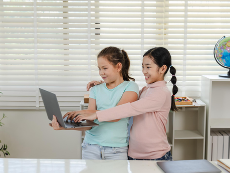 happy kids using laptop