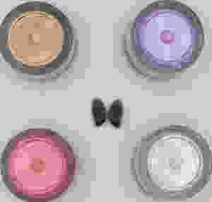 coquina shell surrounded by mica pigments in gold, purple, pink, and white.