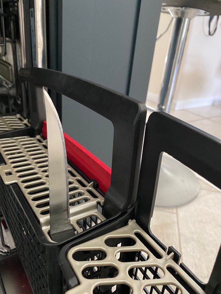 Knife blade up, handle down in dishwasher basket